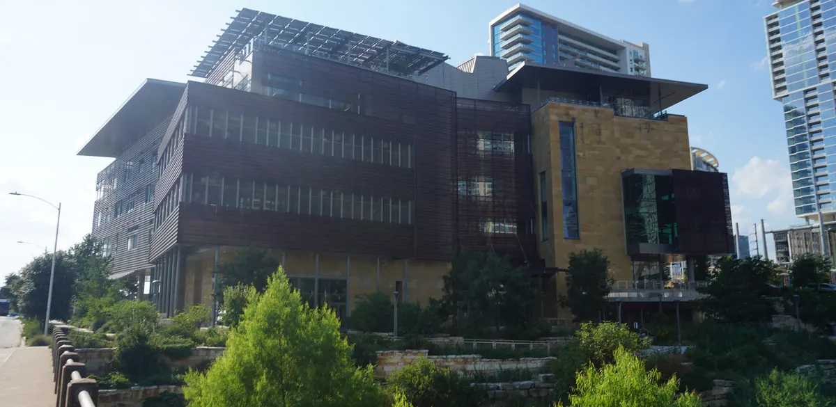 Exterior of Austin Central Library, with its glass facade and roof canopy.